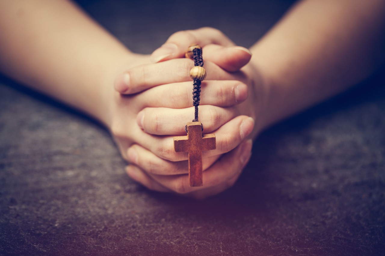 Religious Discrimination Woman holding cross