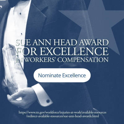 SueAnnHead-Nominations A photo of a man wearing a formal suit holding a crystal glass award.