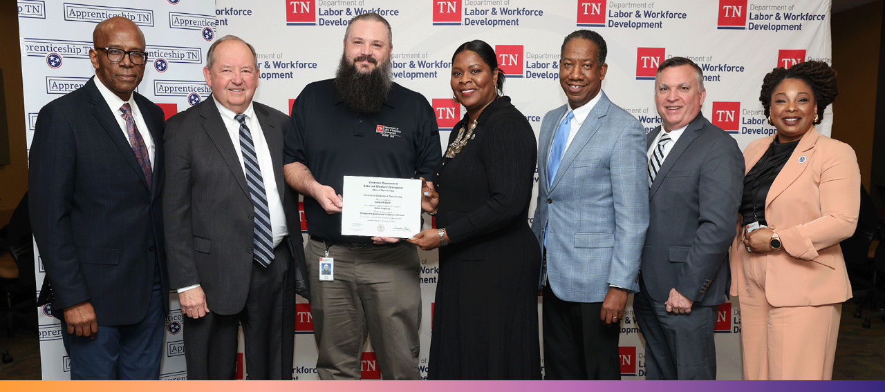 Commissioner Deniece Thomas congratulates Jimmy Watson