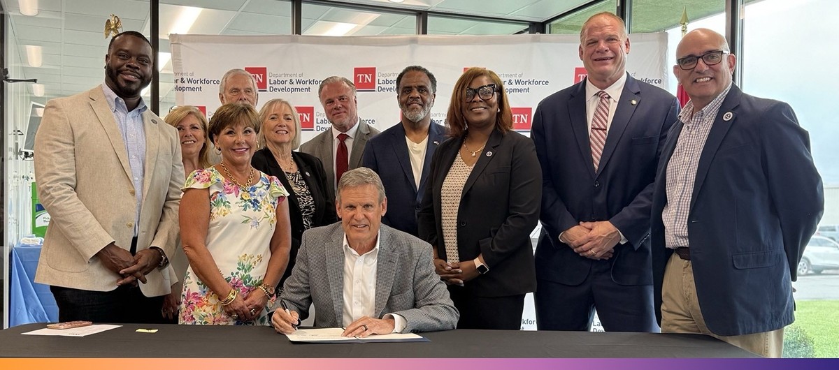 Executive Order 109 A group of people gather around Gov. Bill lee at a table as he prepares to sign a document