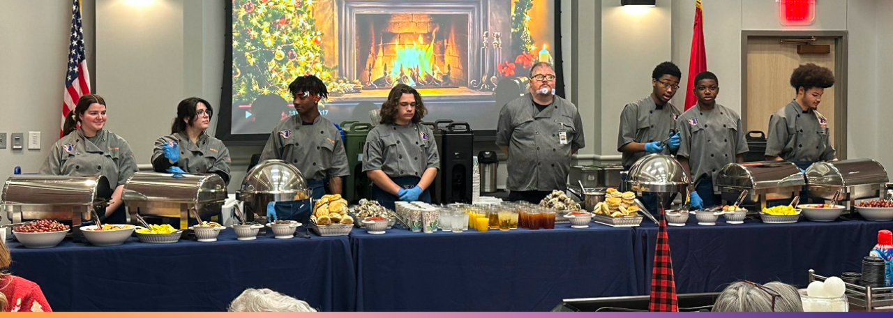 Blackman culinary students serve breakfast Culinary students stand behind a long table filled with breakfast dishes