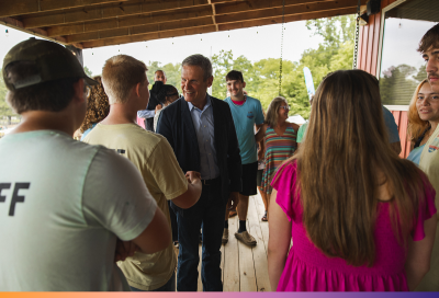 Youth Employment Program Gov. Bill Lee shakes hands with a youth while other youths stand nearby